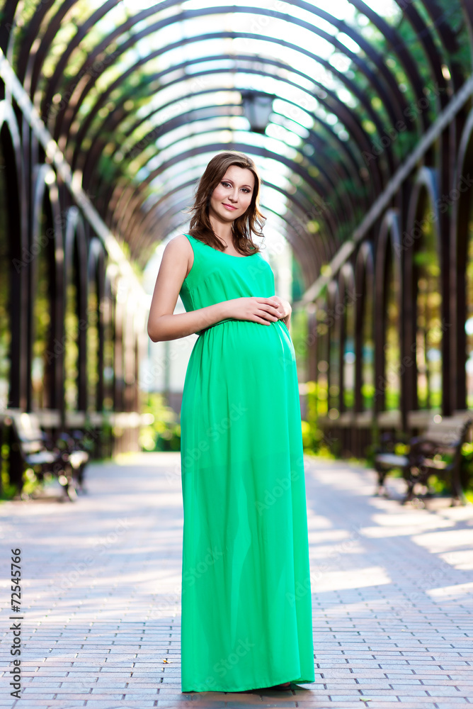 Beautiful pregnant woman feeling lovely