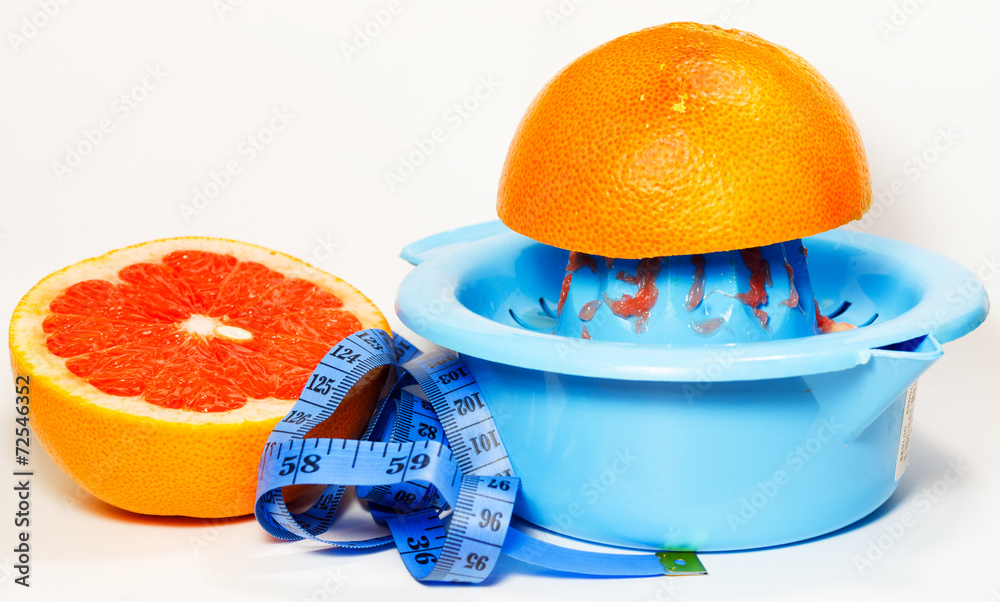 Dieting сoncept with the grapefruit and meter