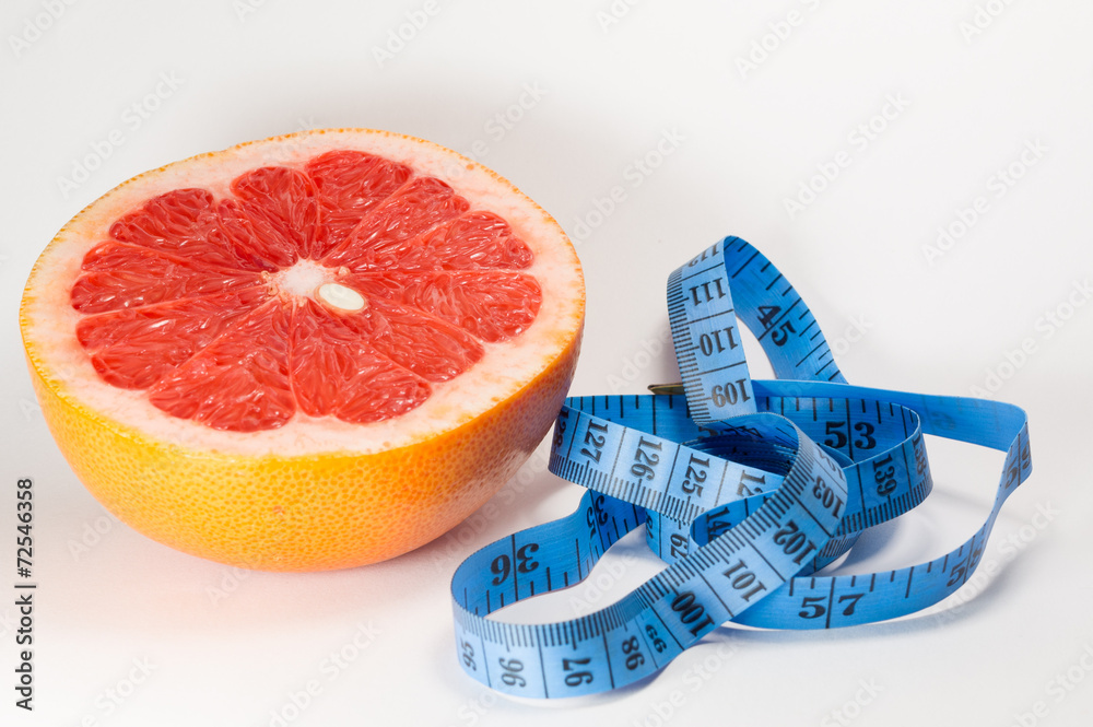 Dieting сoncept - meter and grapefruit