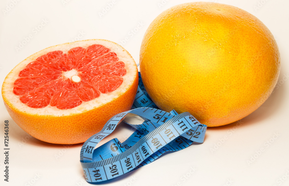Dieting сoncept with the meter and grapefruit