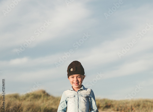 Little girl smiling outdoors with a big copy space © ramonespelt