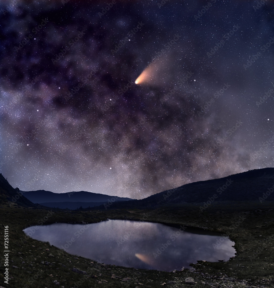 Comet over mountain lake