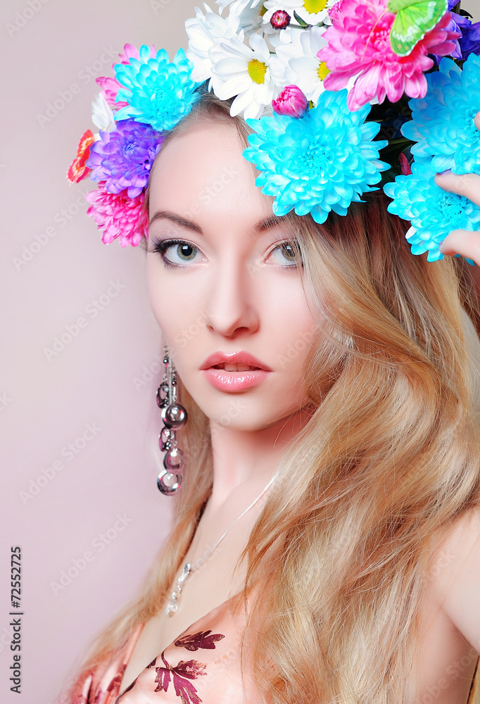 spring portrait of beautiful girl with flowers in studio