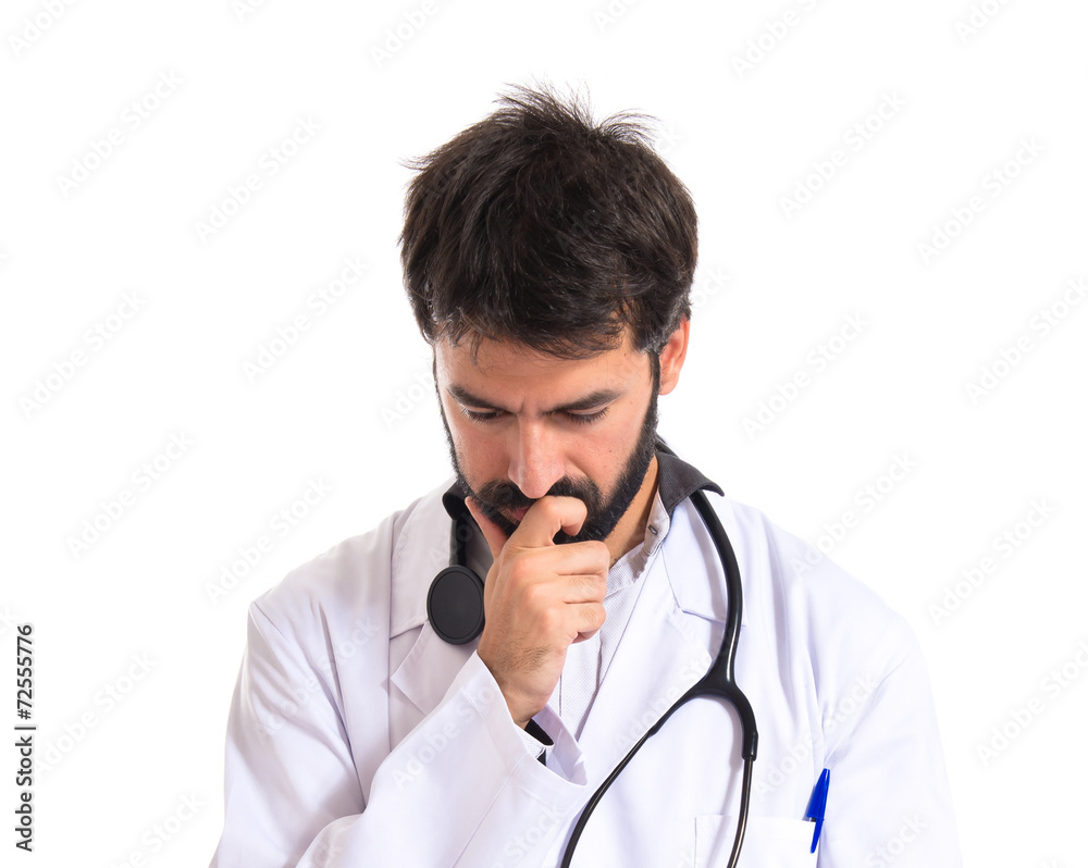 Doctor reading a book over white background Doctor reading a book over white background