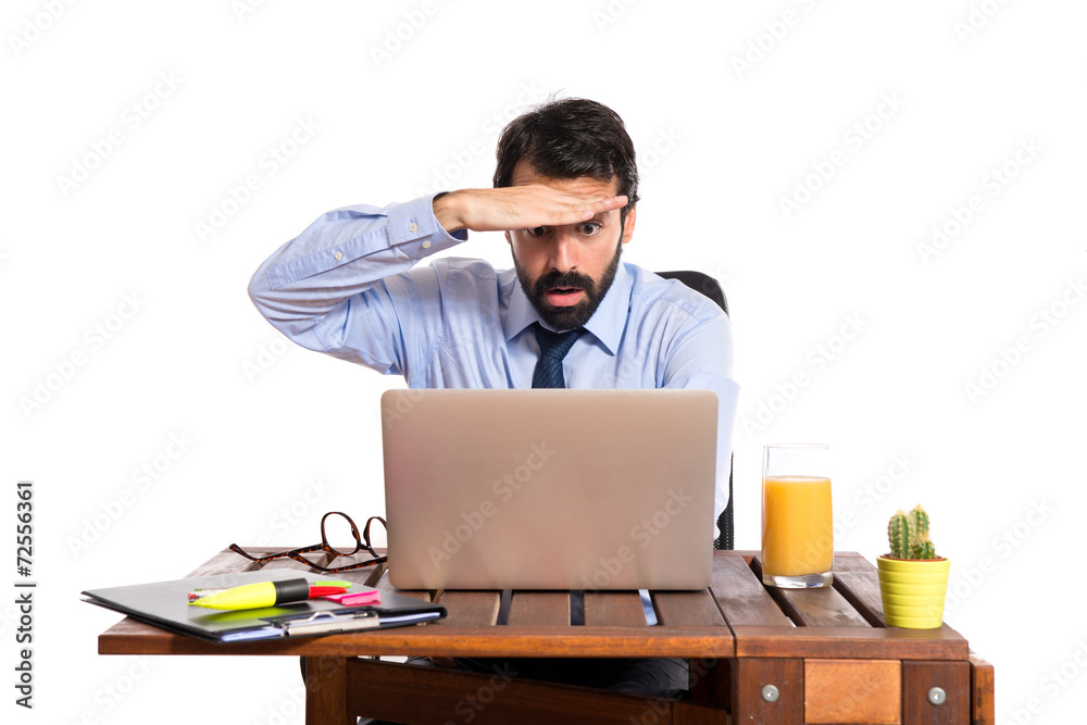 Businessman in his office showing something Businessman in his office showing something