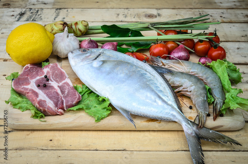 Fresh meat ,seafood  and vegetables on kitchen board