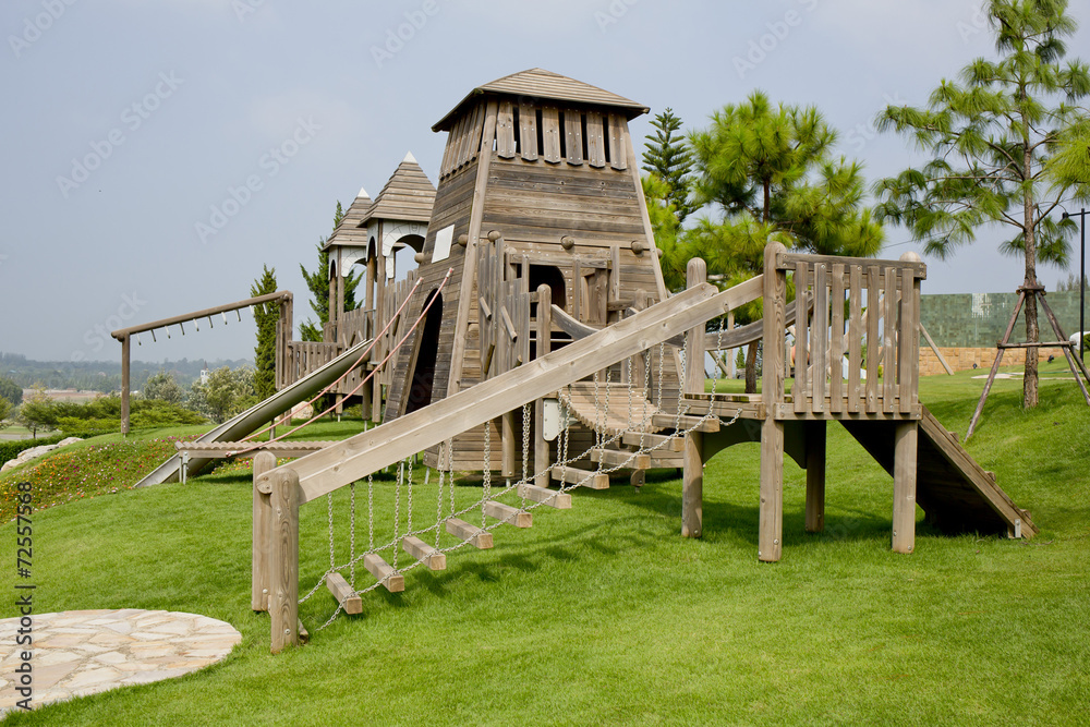 Children's Playground made from wood in park Children's Playground made from wood in park