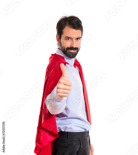 Businessman dressed like superhero with thumb up