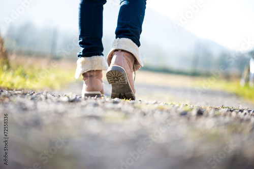 Woman walking along a rural path