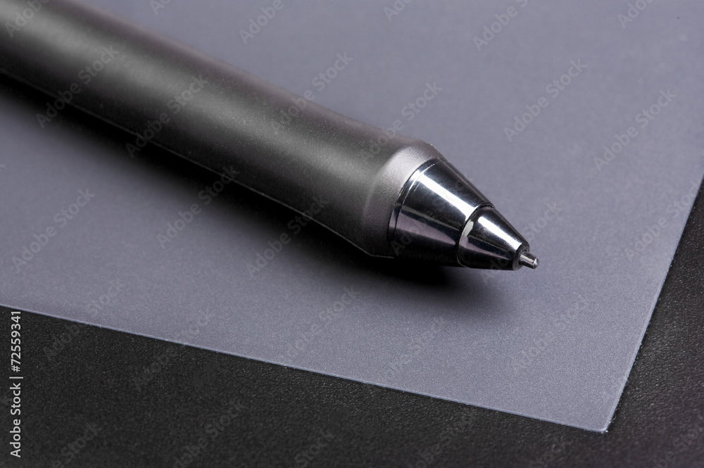 Graphic tablet with pen closeup Graphic tablet with pen closeup