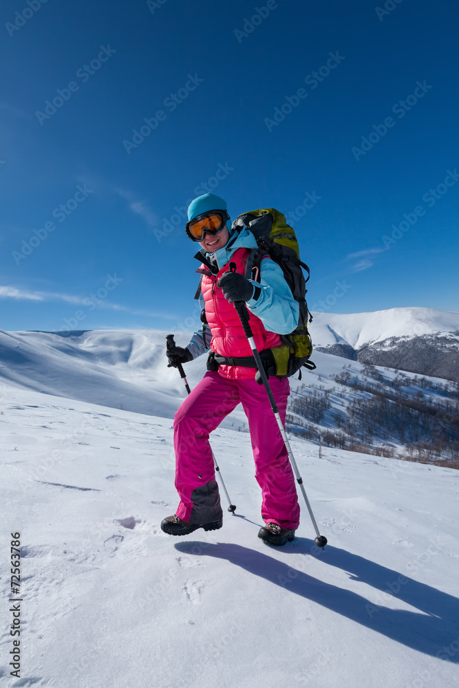 Hiker in winter mountains during sunny day Hiker in winter mountains during sunny day
