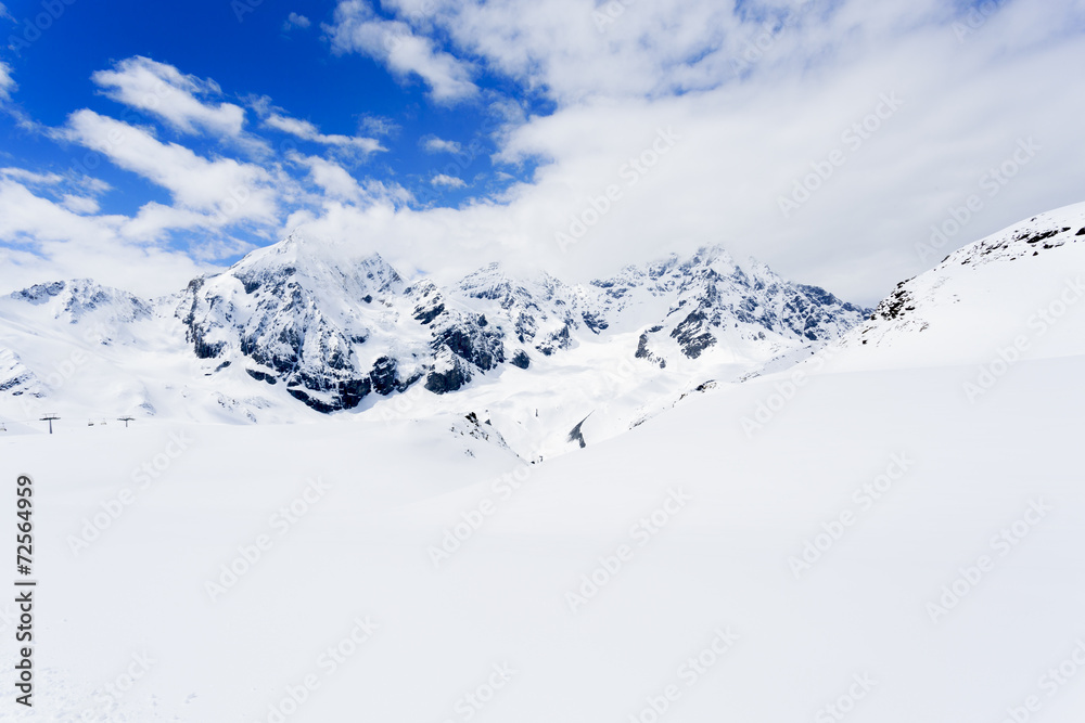 Winter mountains, ski run in Italian Alp