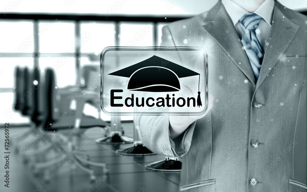 Obraz premium business man pointing 'education' concept