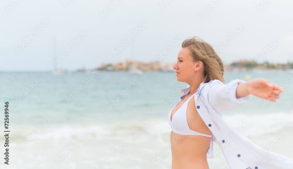 Young woman relaxing near the sea. Space for your text. Young woman relaxing near the sea. Space for your text.
