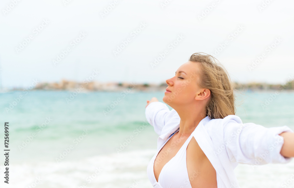 Young woman relaxing near the sea. Space for your text. Young woman relaxing near the sea. Space for your text.