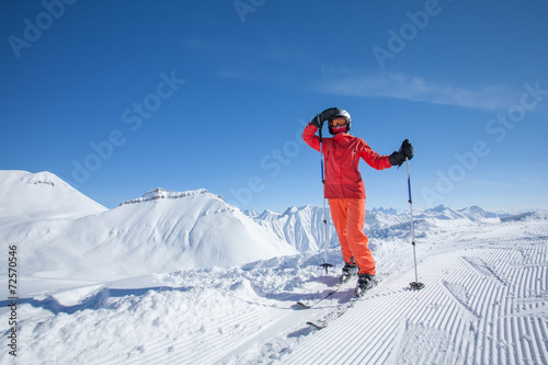Skier is posing at camera
