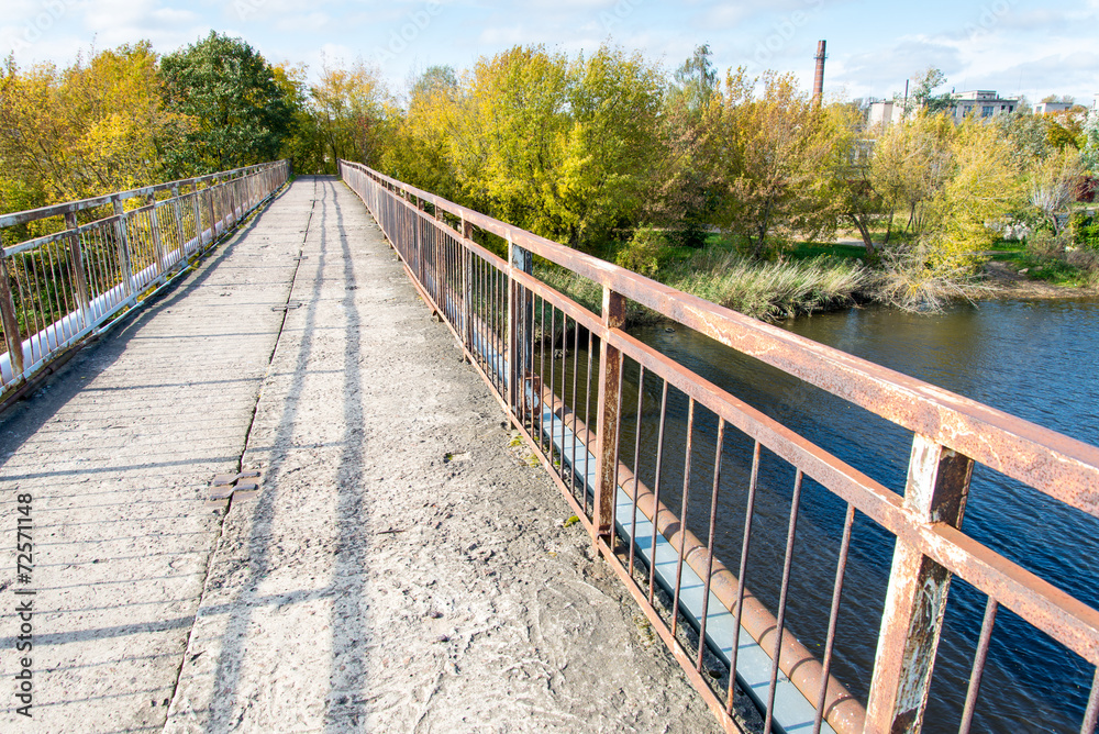 old bridge with rusty metal rails old bridge with rusty metal rails