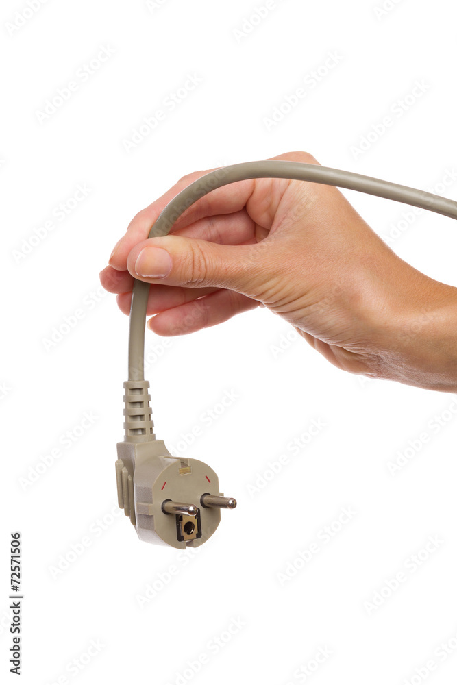 Gray european electric plug in female hand Gray european electric plug in female hand