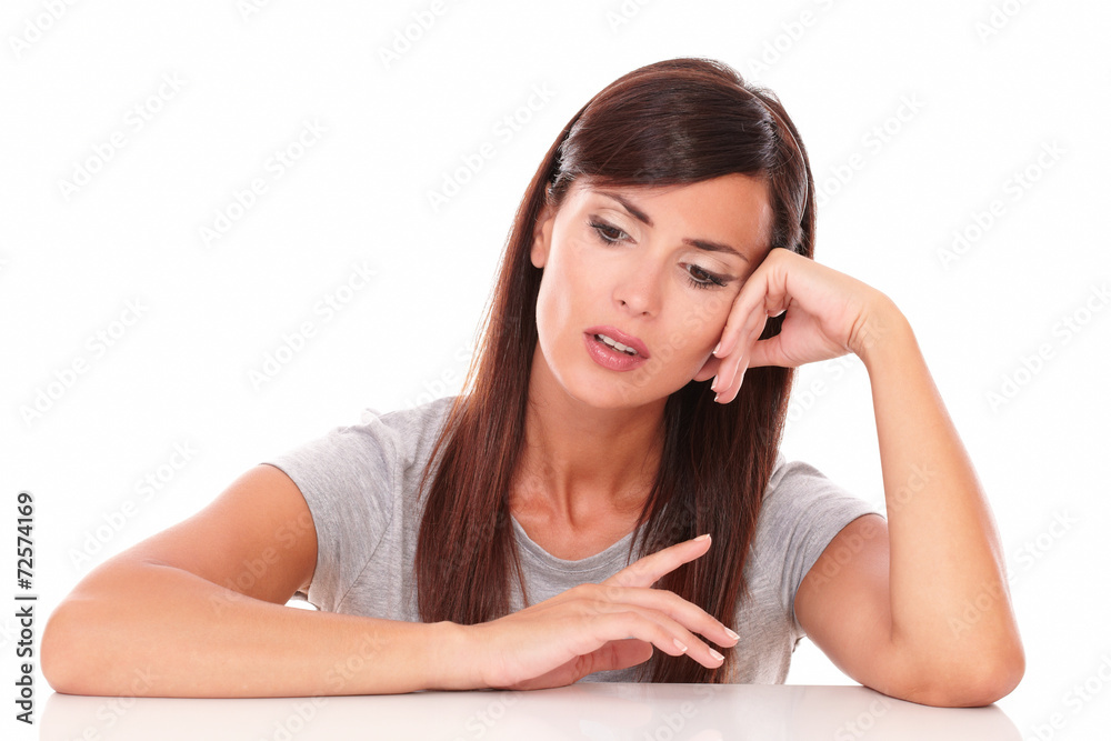 Friendly latin female wondering while looking down Friendly latin female wondering while looking down