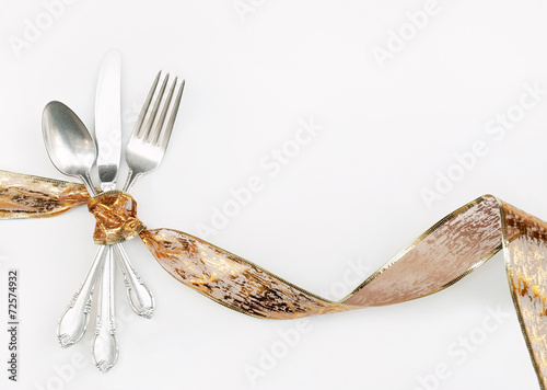 Silverware Wrapped with Hoilday Gold Ribbon