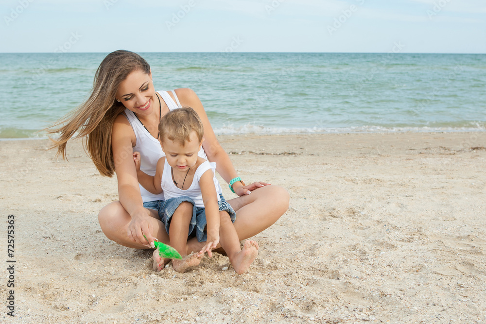 Mother and her son having fun on the beach Mother and her son having fun on the beach