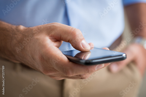 Closeup Of Man Typing Cellphone