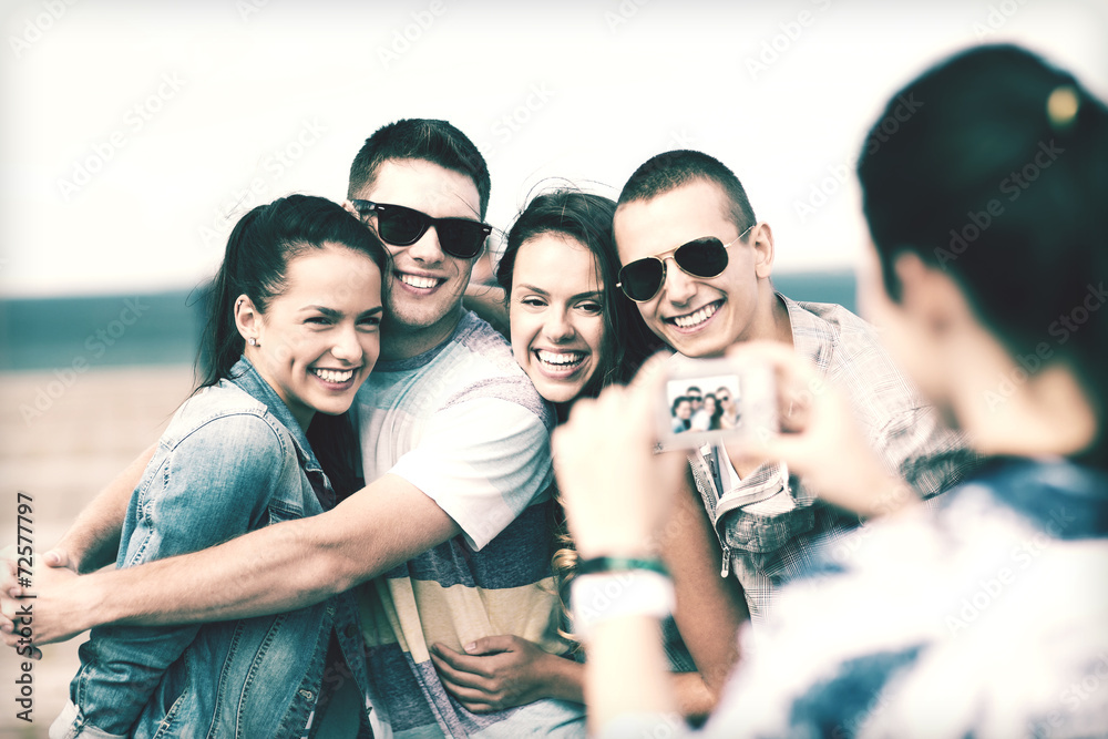 teenagers taking photo outside teenagers taking photo outside