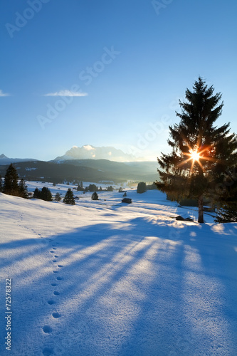 sunset over winter alpine meadows