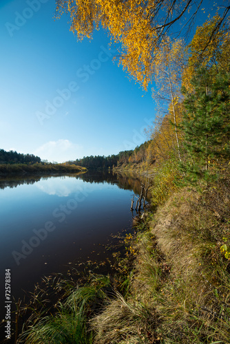 scenic autumn colored river in country