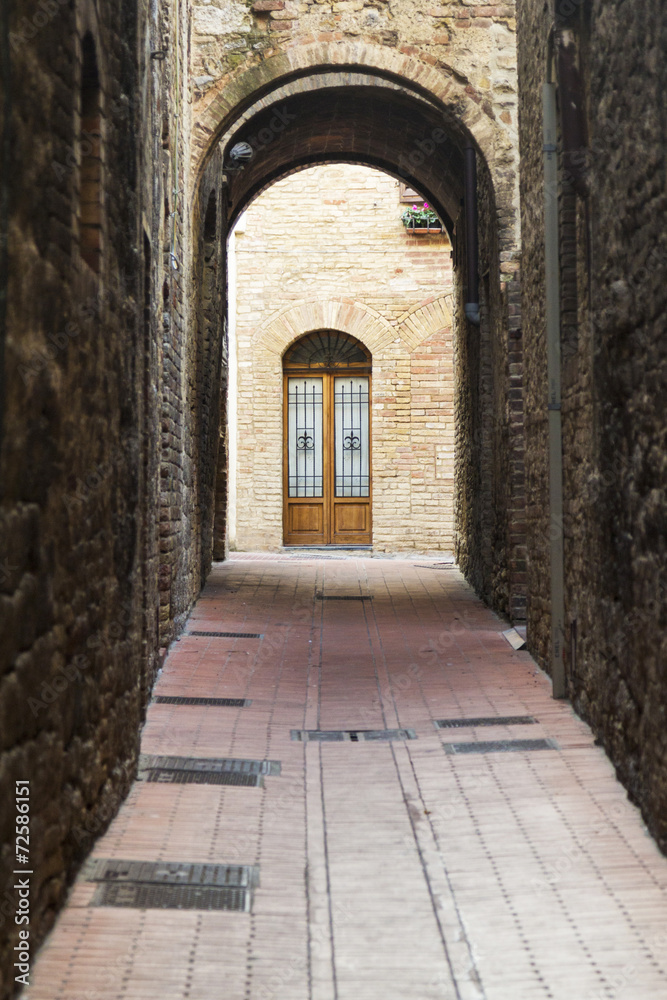 Arch in an old street from Tuscany