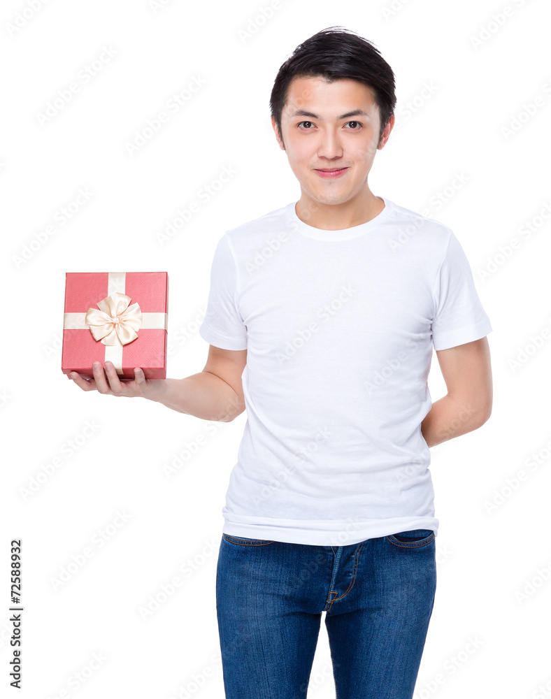 Asian young man give red gift box to you Asian young man give red gift box to you