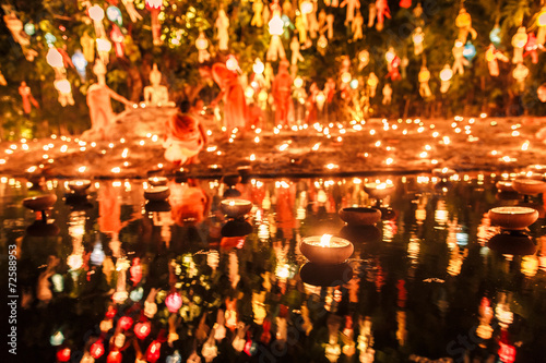 Floating lantern with monk and buddha image in Thai temple