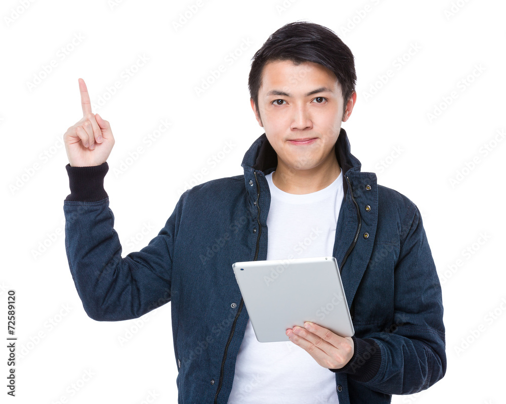 Asian man use tablet and finger point up Asian man use tablet and finger point up