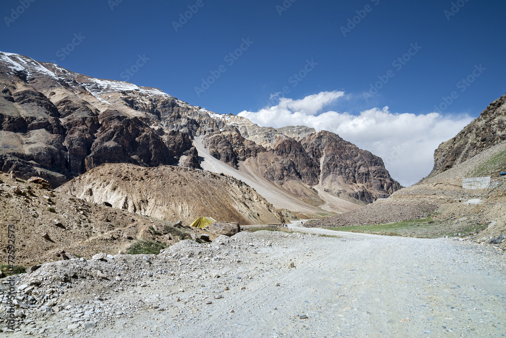Gravel mountain road in ravine