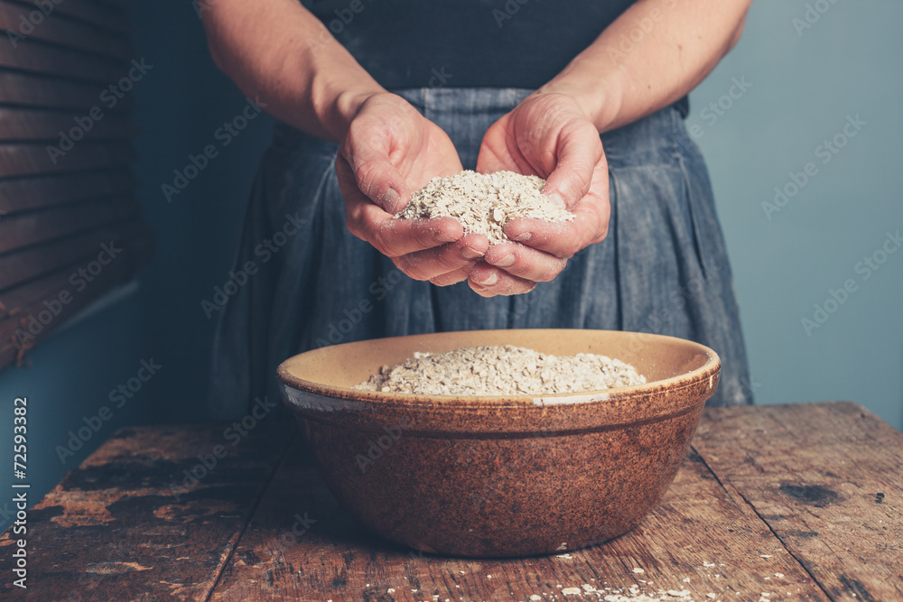 Young woman with oats