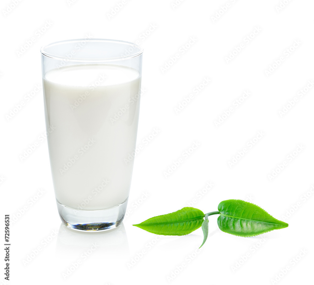 glass of milk and green tea leaf isolated on white background glass of milk and green tea leaf isolated on white background