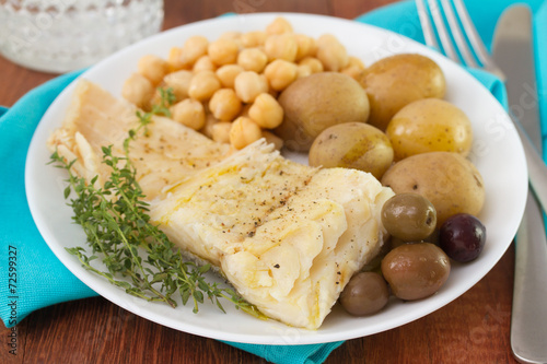 fish with potato and chick-pea on plate