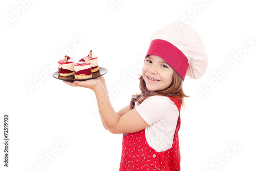 happy little girl cook with raspberry cake