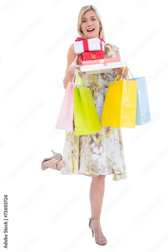 Elegant blonde with shopping bags and gifts