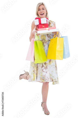 Elegant blonde with shopping bags and gifts