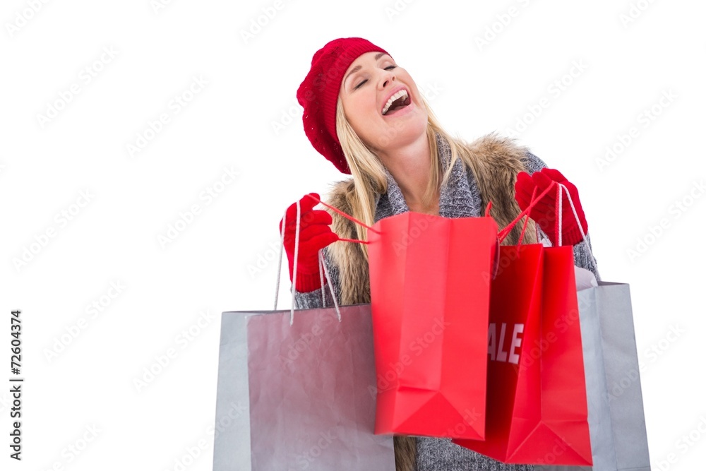 Blonde in winter clothes with shopping bags Blonde in winter clothes with shopping bags