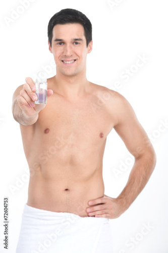 Young handsome men holding deodorant for armpits.
