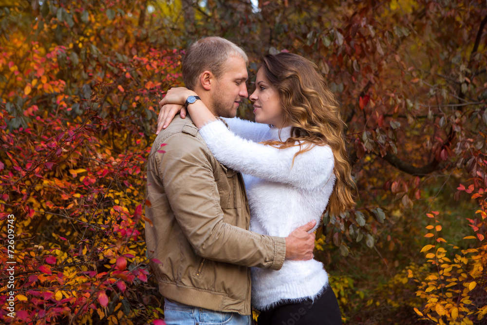 Fototapeta premium Couple walking in autumn Park