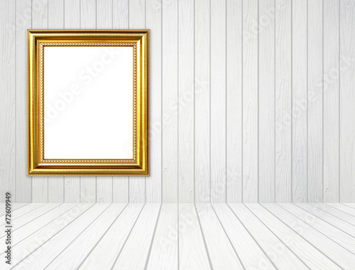golden frame in room with white wood wall and wood floor backgro