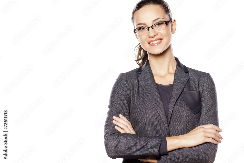 Happy business woman posing with arms folded Happy business woman posing with arms folded