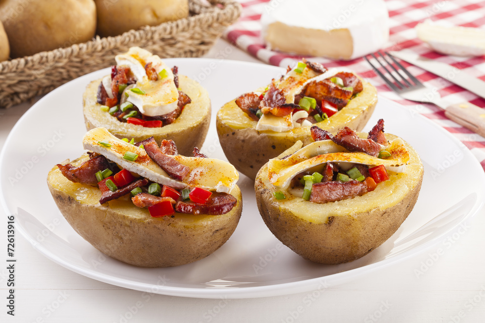 Baked potatoes stuffed with bacon, served with camembert