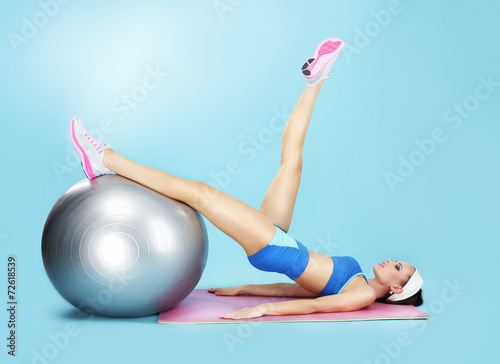 Aerobics. Sportswoman in Sport Club with Fitness Ball