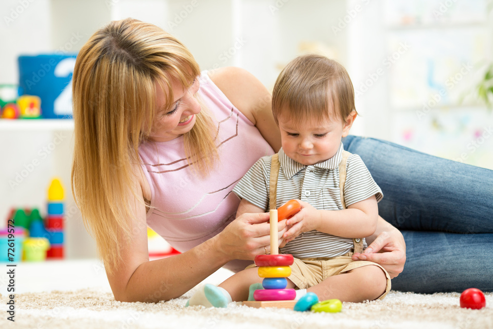 happy mother and child son play together indoor at home happy mother and child son play together indoor at home