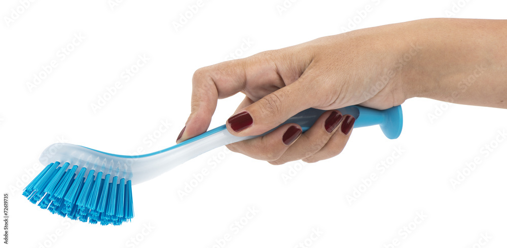 Woman hand holding dishwashing brush isolated Woman hand holding dishwashing brush isolated