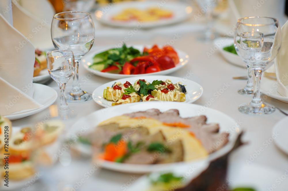 table set service with silverware and glass stemware at restaurant before party table set service with silverware and glass stemware at restaurant before party